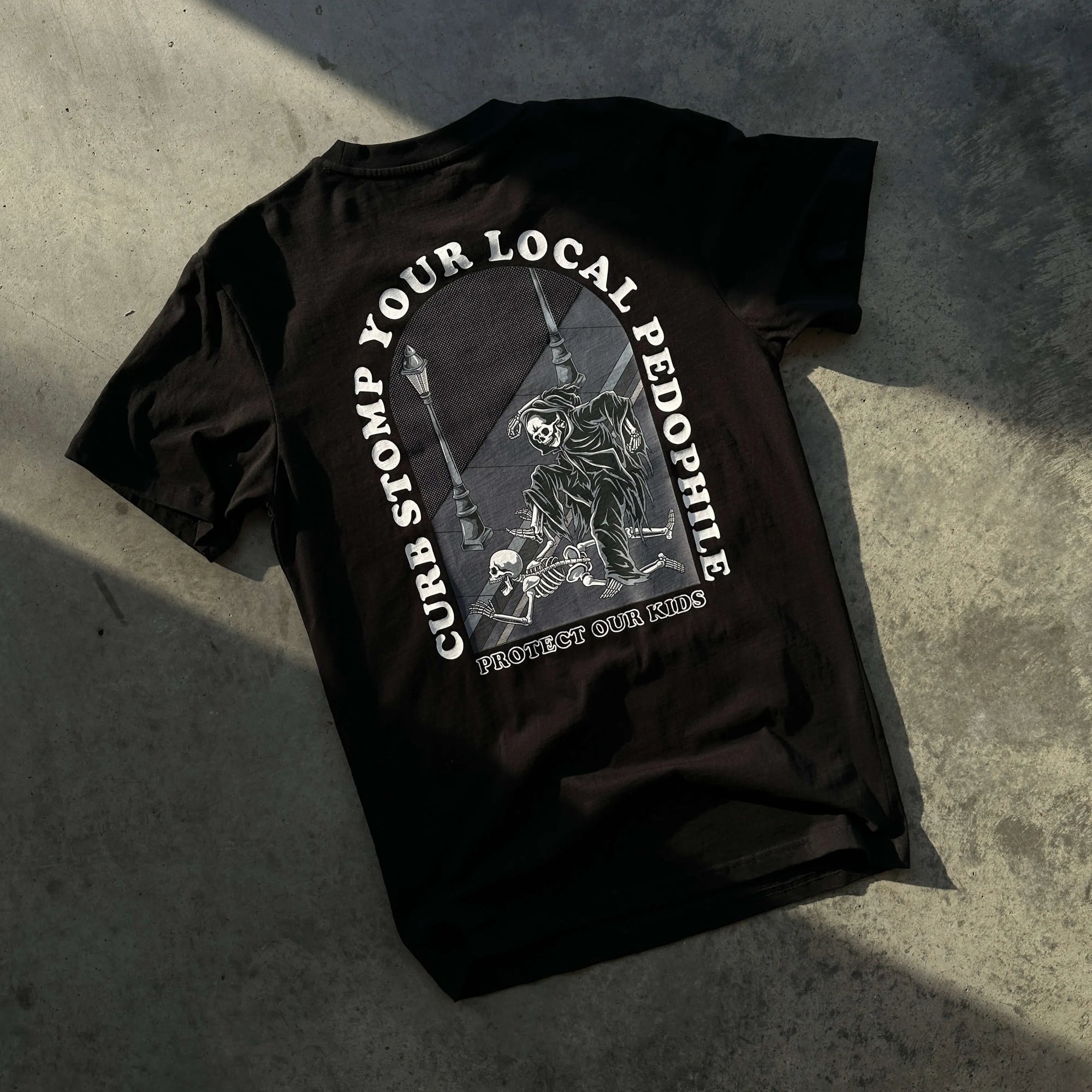 Curb Stomp Your Local Pedophile Shirt Laying Flat on the Floor