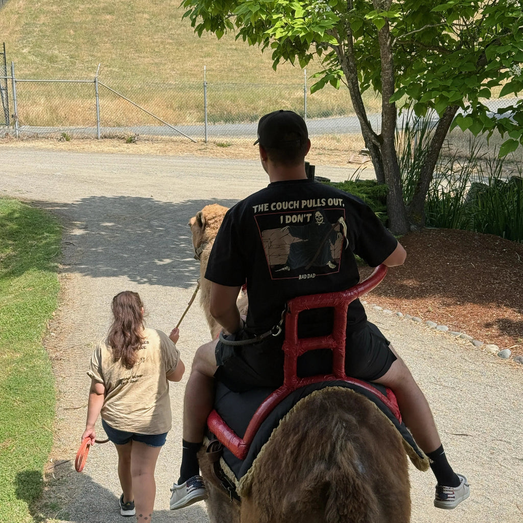 Wearing The Couch Pulls Out Shirt and Riding a Camel