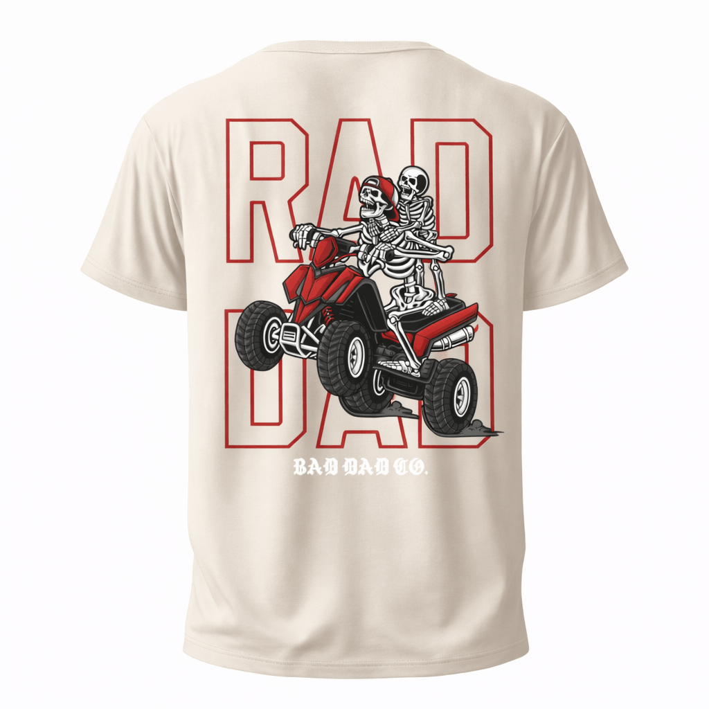 Rad Dad Shirt in Sand Color | Back Design Skeleton Dad & Son Riding a 4-Wheeler Doing a Wheelie With Big Text in red outline "RAD DAD"