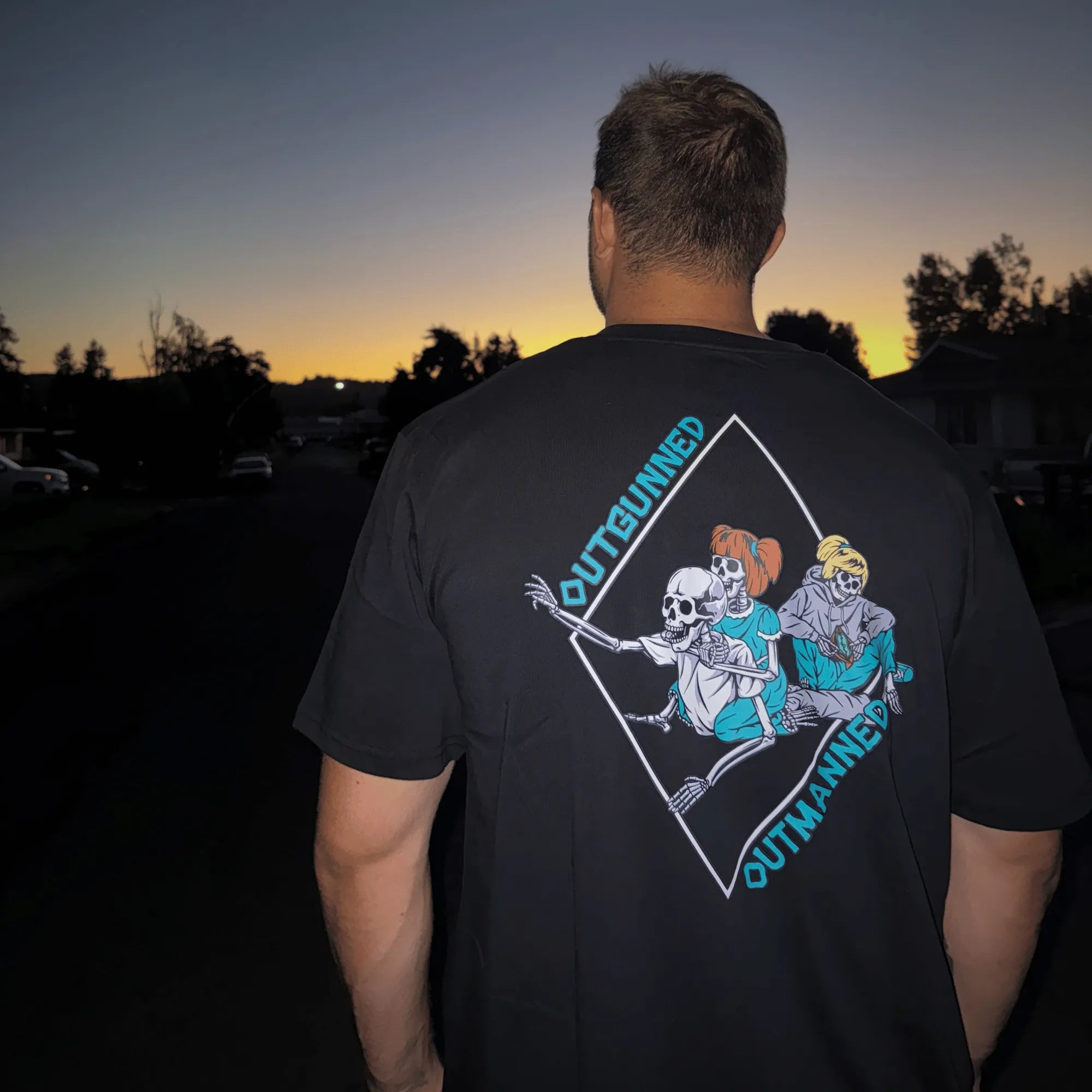 Wearing Outgunned shirt at Sunset